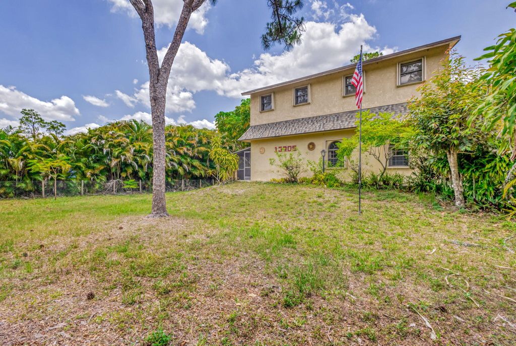 Photo of 13705 Persimmon Boulevard, The Acreage, FL 33411 (MLS # R11092127)