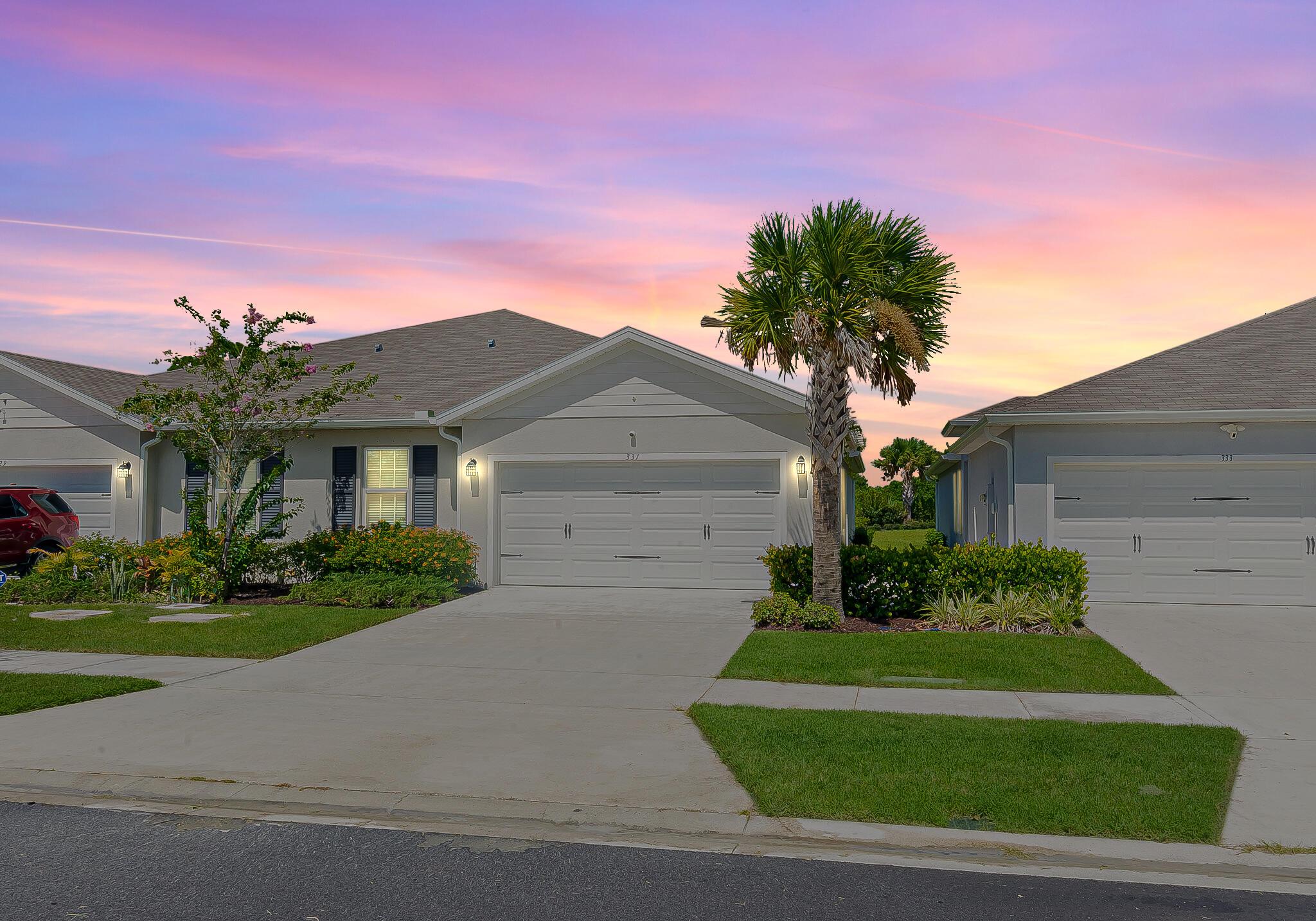 Avalon Crossing! Almost new 3/2/2 CBS Villa is available now. Tile floors in the main areas, great room, open floor plan. Kitchen has granite counters, plenty of wood cabinets, stainless appliances, pantry. Private backyard with covered and screened lanai. Over $20k in upgrades, freshly painted interior. Camera security system, smart doorbell included. HOA provides community pool, play area, lawn care. Easy commute to I95. Don't wait!