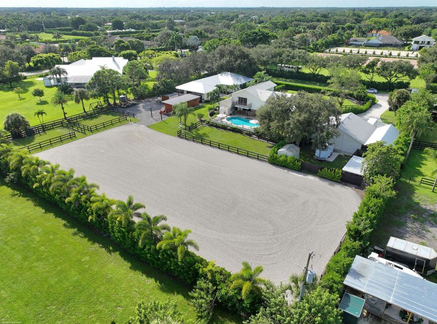 SEASONAL BARN RENTAL.  PRICE REFLECTS THE  MONTHLY RATE FOR THE ENTIRE BARNS INCLUDING 1 BEDROOM APARTMENT.  4 MONTH MINIMUM LEASE TERM IS REQUIRED.  Inviting newer facility with everything you need to enjoy the Wellington equestrian lifestyle! Located in the esteemed neighborhood of Paddock Park 2 on just under 2 acres, this commercially built barn (completed in 2016) features 7 stalls in the main barn + 3 additional new shed row stalls, a full bath, tack room with laundry, feed room and a lounge. Additionally, there is a 504 sqft large 1 bdr/1 bath apartment with a kitchen. The barn is equipped with rubber matting throughout, fly spray system, security cameras, fire alarm and sprinklers.   West driveway, house and garage/workshop are not included in this rental offering.