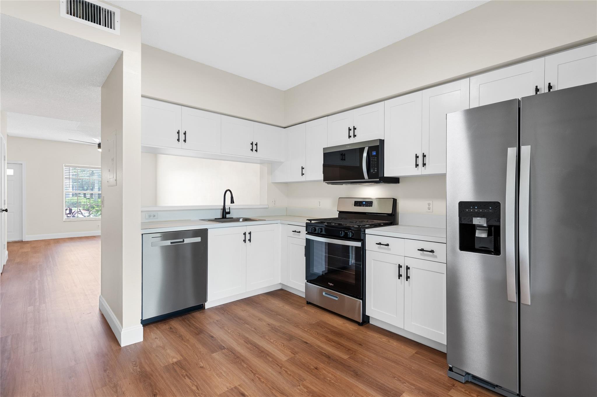 Corner Townhome with a Single Family feel! The perfect blend of style, space & location!! Natural light pouring in from the North & South. Brand New Luxury Waterproof Vinyl Flooring on 1st & 2nd floors * New 5" Baseboards * Large kitchen w/updated cabinets, brand new kitchen appliances plus Brand New Washer/Dryer * New fans, lighting fixtures, faucets, door knobs * New Custom Vanity * Just Painted Inside! * Outside Painted & Pressure Washed Patio * Extra storage closet in roofed & screened patio * LOW $314/mo maintenance * 3 mi. to  Sawgrass Expwy & 6 mi to the Sawgrass Mall * Located on a private side street of the Community - Walking distance to Sunset Point & Tephord Park.