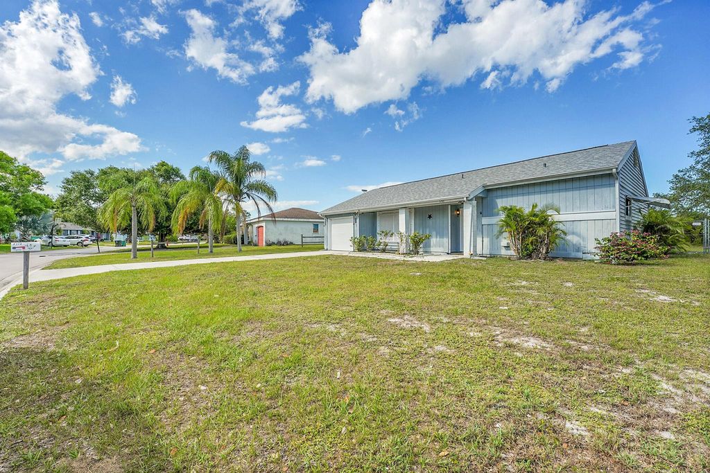 Photo of 1701 SE Burgundy Lane, Port Saint Lucie, FL 34952 (MLS # R11090620)