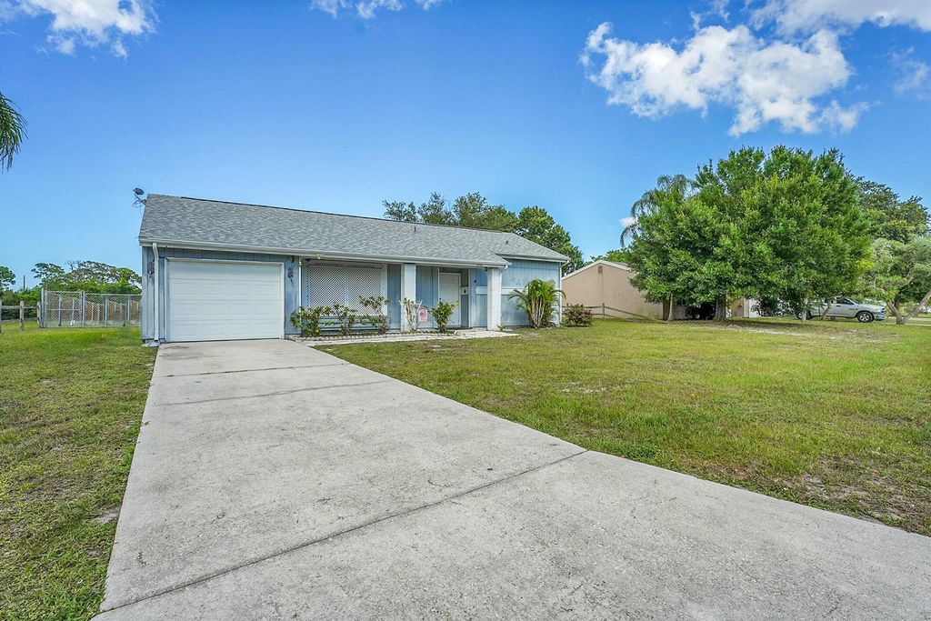 Photo of 1701 SE Burgundy Lane, Port Saint Lucie, FL 34952 (MLS # R11090620)