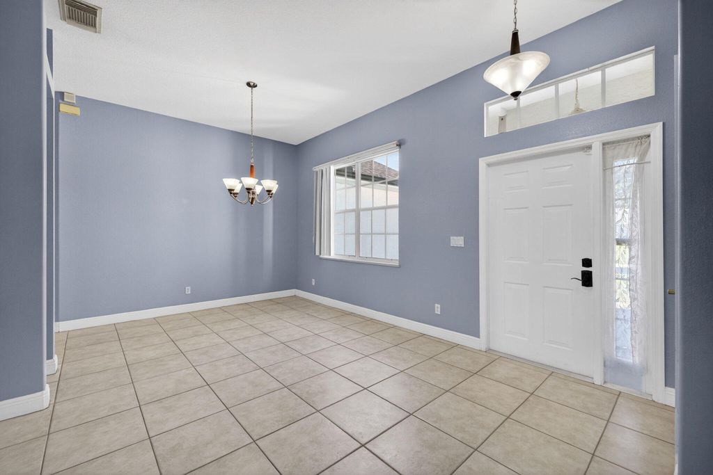 Photo of 1221 SW Wellington Avenue, Port Saint Lucie, FL 34953 (MLS # B26025782)