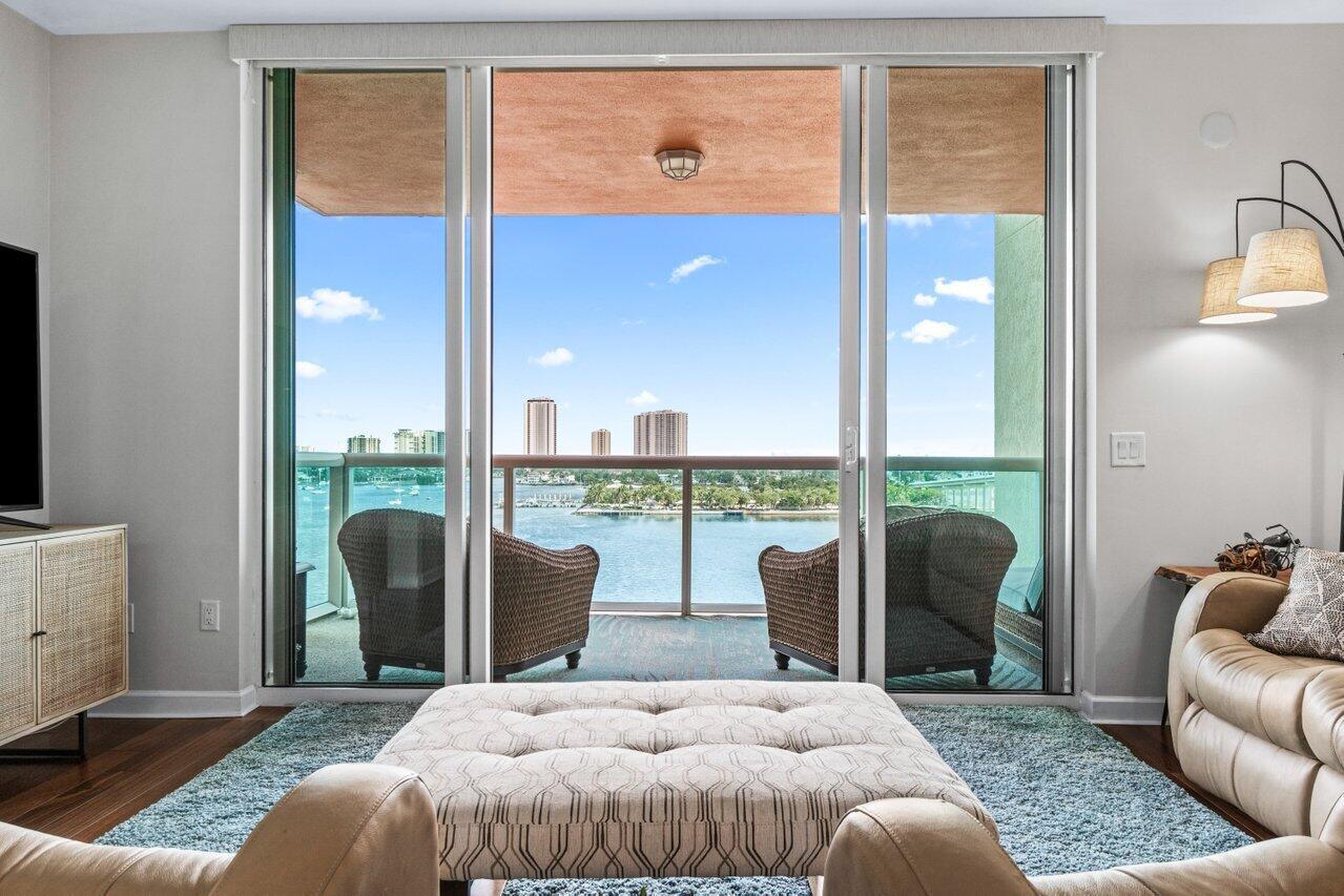 Pristine 9th floor 2BR+den/3BA overlooking the Intracoastal & ocean, available for annual or off season. Impact glass, semi-private elevator access. Open concept, split floor plan with Den can be used as 3rd BR. Main living areas w engineered wood floors! Spacious owners suite w/his & her walk-in closets. Primary bath w/double vanity, jetted bath & water closet. Stainless steel appliances in the open kitchen. Assigned garage parking & climate-controlled storage unit. 24/7 manned gate, valet, NEW tennis, NEW pickleball and bocce, walking path w/gazebo, Newly renovated rooftop oasis w/pool, spa, BBQ areas, clubhouse, billiard room & fitness center. Marina w/dry docks available. Pet Friendly Community. Ready for you to enjoy and watch the sunrise every morning - Immaculate Condo