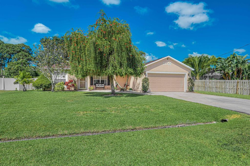 Photo of 1960 SE Bowie Street, Port Saint Lucie, FL 34952 (MLS # R10981409)