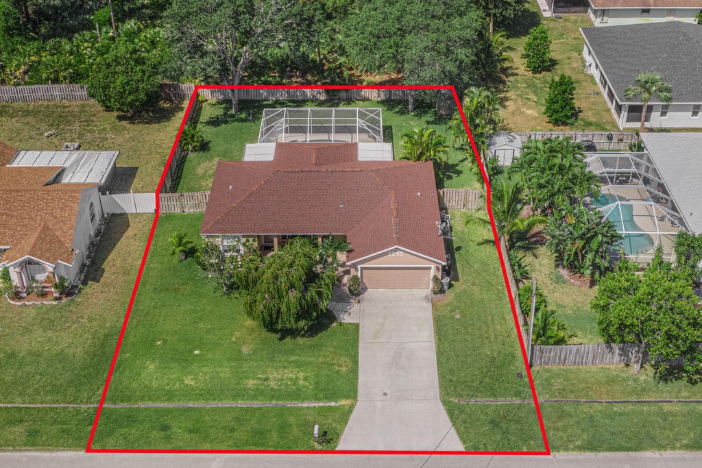 Photo of 1960 SE Bowie Street, Port Saint Lucie, FL 34952 (MLS # R10981409)