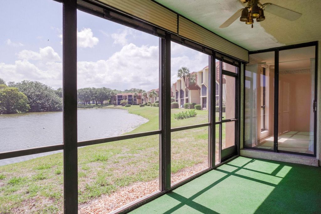 Photo of 5188 Woodland Lakes Drive #137, Palm Beach Gardens, FL 33418 (MLS # R10880135)