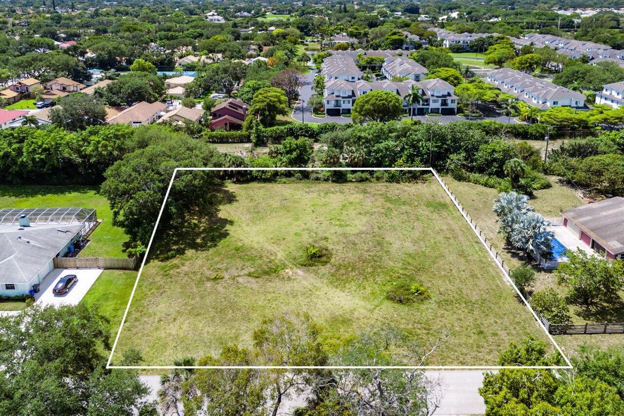 Discover the perfect canvas for your dream home in the sought-after Kingsland community of Delray Beach. This expansive vacant lot measures an impressive 185 feet in width and 208 feet in depth, offering ample space to build your ideal residence. Nestled in a serene county pocket, this lot provides a tranquil escape while remaining conveniently close to the vibrant offerings of Atlantic Avenue. Included with the sale are architectural plans for a stunning two-story single-family home, designed to maximize comfort and style. The proposed home features a total of 4,550 square feet under air, with main floor primary suite and two-car garage. Imagine living in a beautifully designed space tailored to your lifestyle, with generous room for family gatherings, entertaining, and relaxation.