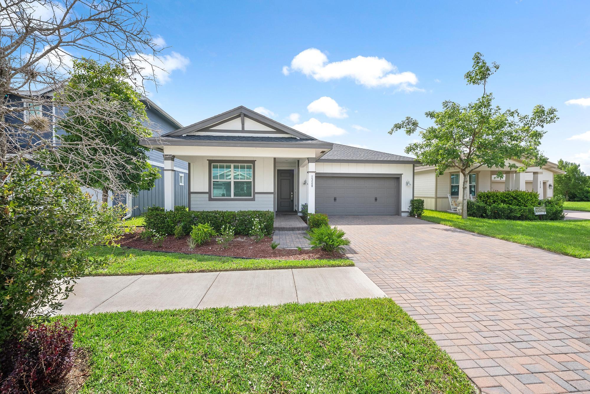 Exceptional Opportunity in the Arden Community!This beautifully upgraded 3-bedroom, 2-bath home offers exceptional features, including soaring ceilings, 42'' white shaker cabinets, and quartz countertops throughout the kitchen and bathrooms. The primary suite showcases a frameless glass shower, dual vanities, and a spacious walk-in closet. Additional highlights include hurricane impact windows, a separate laundry room, and a spacious 2-car garage with direct access to the home. Arden offers an unmatched lifestyle with resort-style amenities, including two pools, a state-of-the-art fitness center, tennis and pickleball courts, basketball and soccer fields, and over 20 miles of scenic walking and biking trails. The community also features a 5-acre working farm, clubhouse, and a vibrant