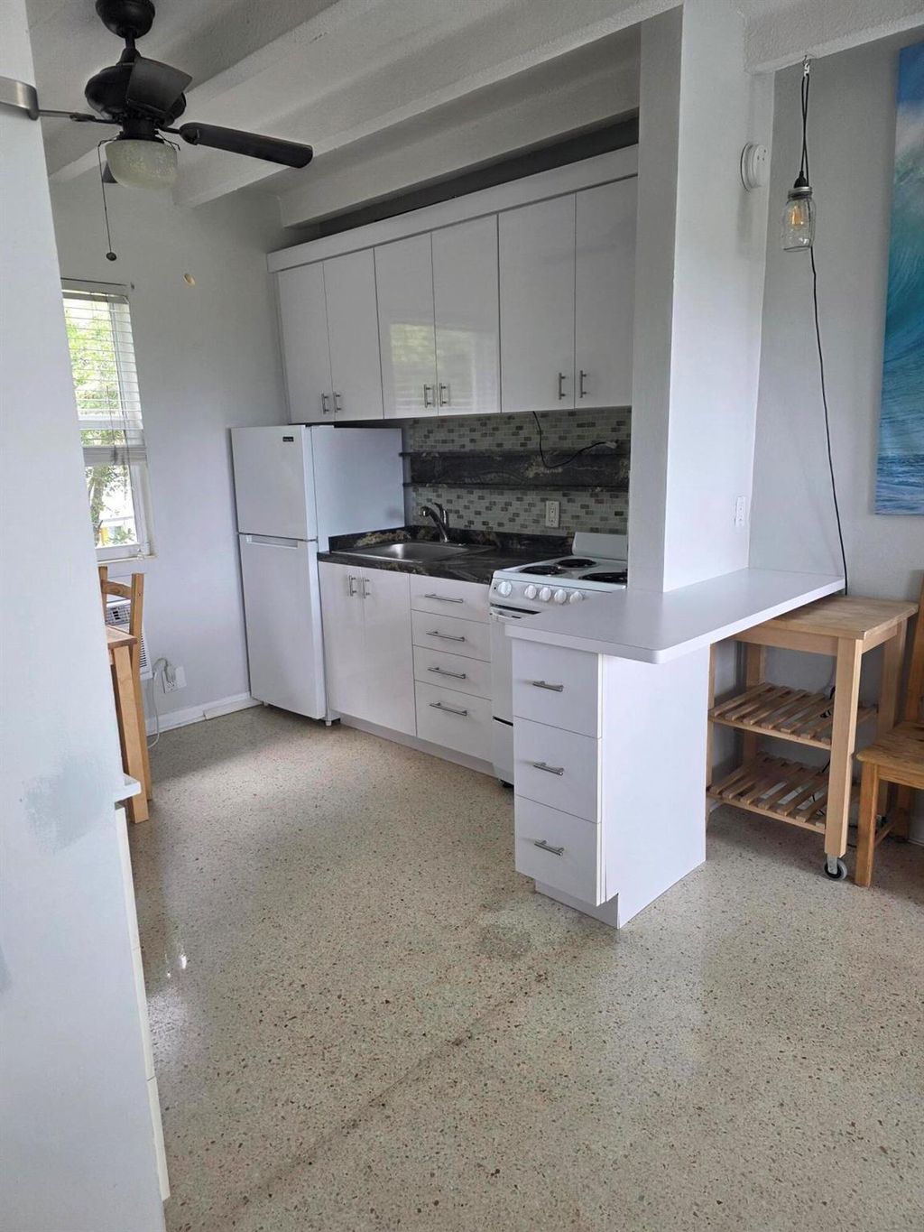 Photo of 100 Cascade Lane #7, Palm Beach Shores, FL 33404 (MLS # R11118087)