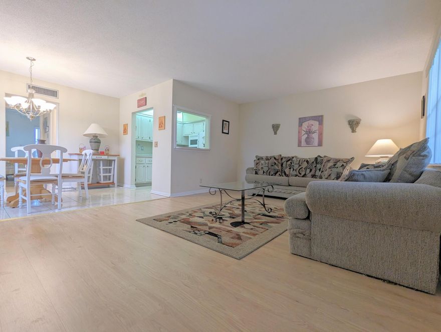 Located near the clubhouse and Haverhill gate, this desirable corner 1 bedroom / 1.5 bath residence offers comfortable South Florida living in a classic Century Village garden-style building. Features include central air conditioning, furnished turnkey convenience, updated bathrooms, an ensuite full bath, and two walk-in closets. Recent laminate flooring enhances the living room and bedroom suite, while the enclosed balcony provides additional living space and relaxing views. Additional upgrades include a new electrical panel and access to a wonderful resident patio area. Residents enjoy the exceptional amenities of the gated 55+ Century Village West Palm Beach community, including pools, clubhouse theater, tennis, pickleball, courtesy transportation, fitness facilities, 24-hour security.