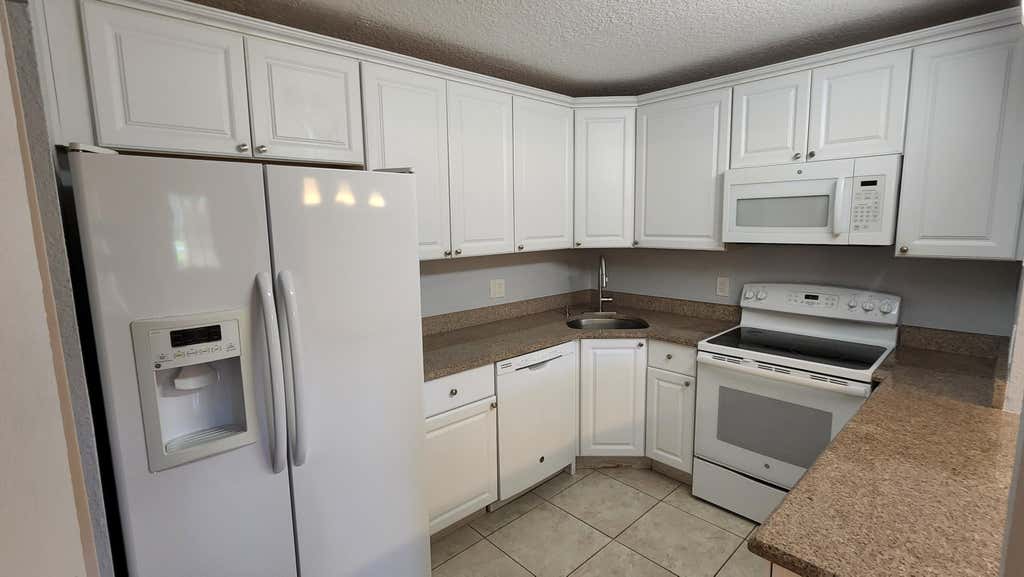 Photo of 527 Shady Pine Way #C1, Greenacres, FL 33415 (MLS # B26037403)