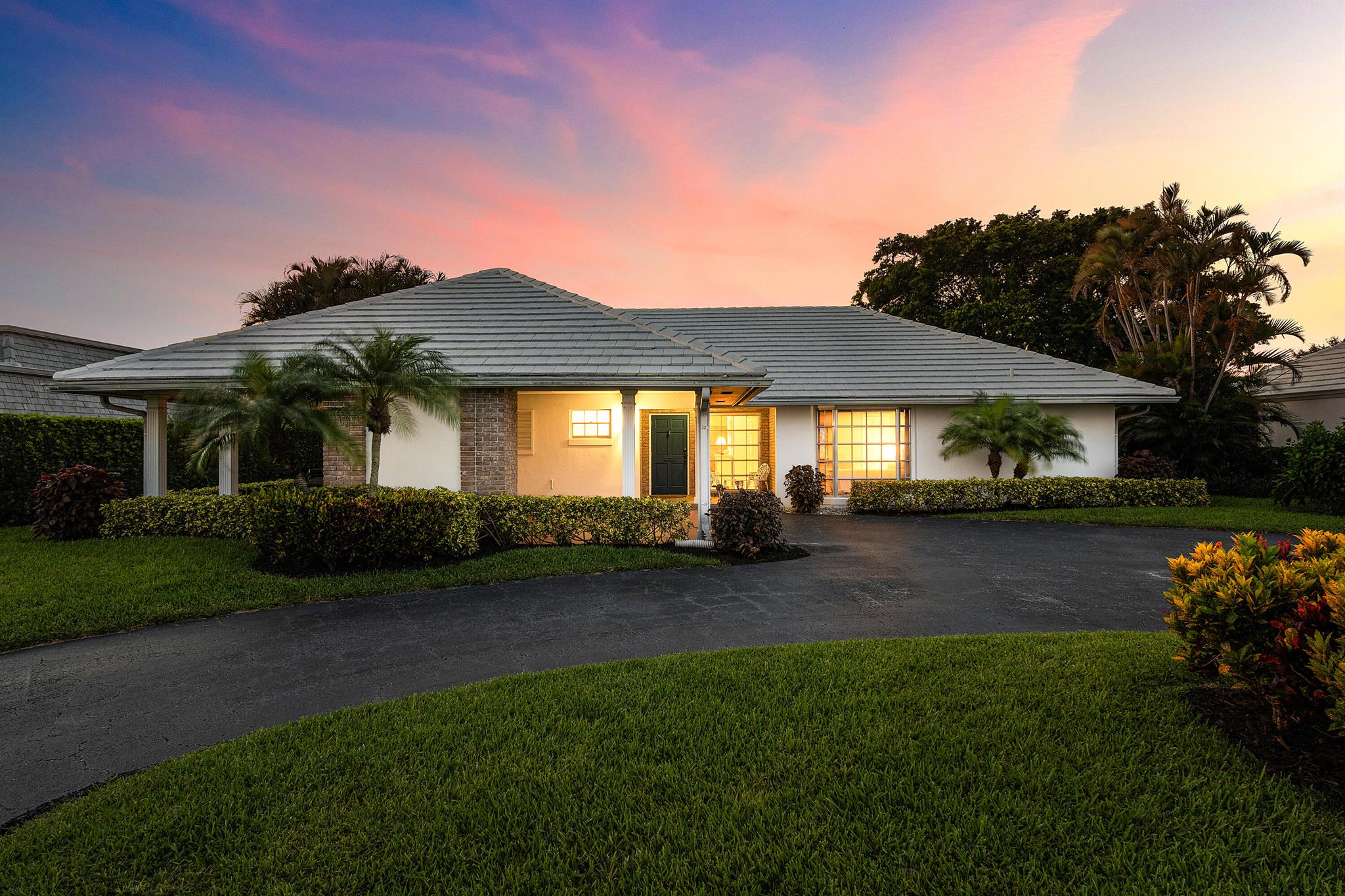 RARE 4-BEDROOM SINGLE FAMILY HOME WITH SWEEPING FAIRWAY VIEWS!Welcome to one of the most desirable golf course lots in the Colony Key Villa community of Atlantis! With over 2,200 living square feet and a triple-split floor-plan you have all the space you need to feel right at home. Sited directly on the 9th hole of The Lost City Golf Club's Signature Course, this home captures stunning open golf vistas and glowing sunsets from nearly every angle. The heart of the home is a 41' x 13' light-filled, glass-enclosed morning room--perfect for entertaining guests or enjoying peaceful mornings overlooking the fairway. Sizable bedrooms + Flex/Bonus Room, a large circular driveway & modern wood flooring throughout the main living areas and are a few of the highlights at 367 Villa Dr. A must see!!