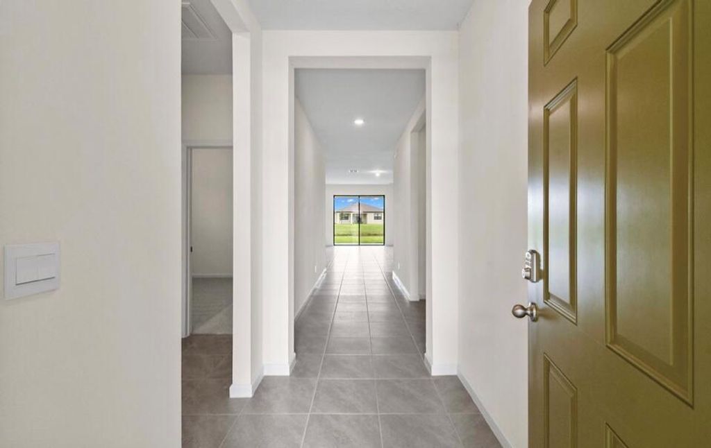 Photo of 10000 SW Triton Way, Port Saint Lucie, FL 34987 (MLS # R11026923)