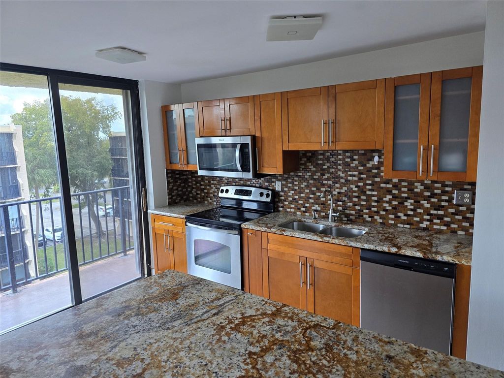 Photo of 3590 Blue Lake Drive #504, Pompano Beach, FL 33064 (MLS # F10555841)