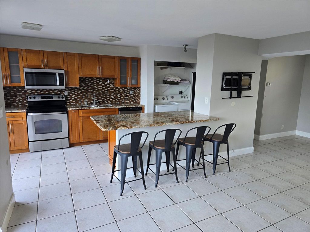 Photo of 3590 Blue Lake Drive #504, Pompano Beach, FL 33064 (MLS # F10555841)