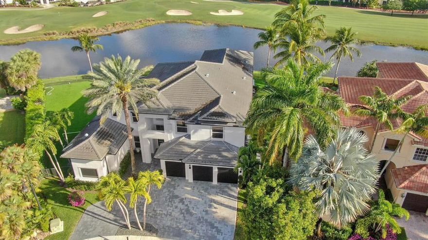 Luxury and sophistication define this contemporary estate , built in 2019 and offered turnkey.Elegant residence with 6160 Sqft under air. High end custom finishes throughout. Grand entrance opens up to a centrally located living room with stunning floor to ceiling windows.The glass floating signature staircase is tucked behind the expansive dining room table with seating for 12. The glass wine room is well located between dining and gourmet kitchen. Main bedroom on 1st floor with his and hers built in closets.Media room on 1st floor with 3 TV's. 2nd floor , 2 en suite bedrooms and large entertainment area. Resort style pool with 40 X 20, surrounded with porcelain tiles, summer kitchen offering sweeping views of the golf course and clubhouse. Whole house generator with 2 large tanks.