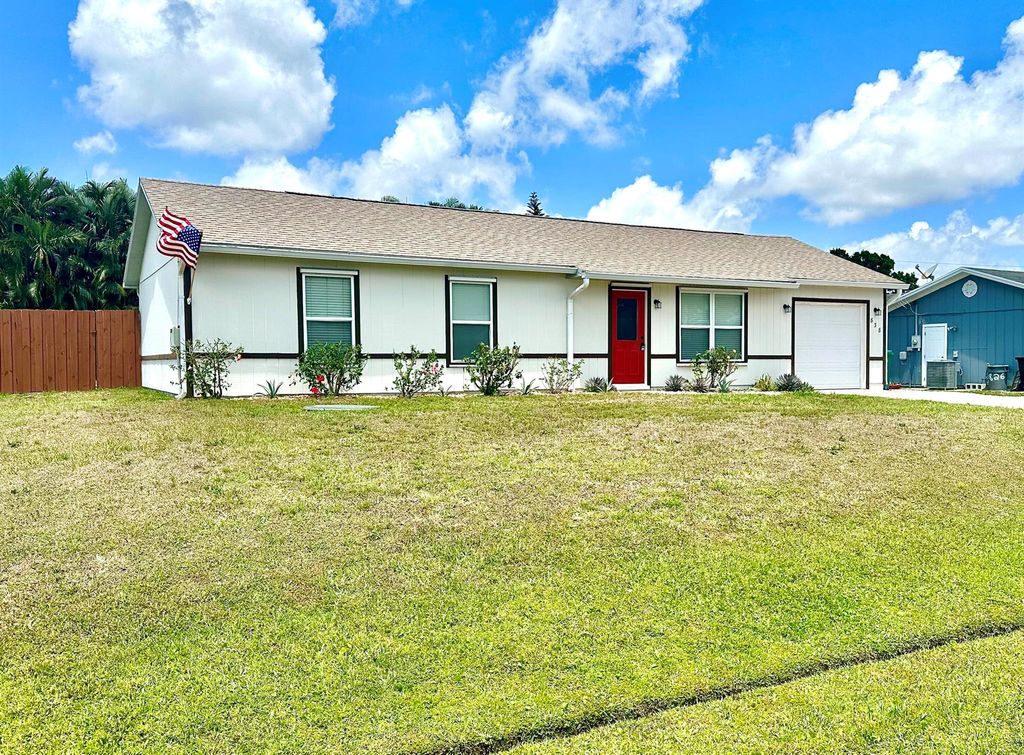 Photo of 838 SW Curtis Street, Port Saint Lucie, FL 34983 (MLS # R10985025)