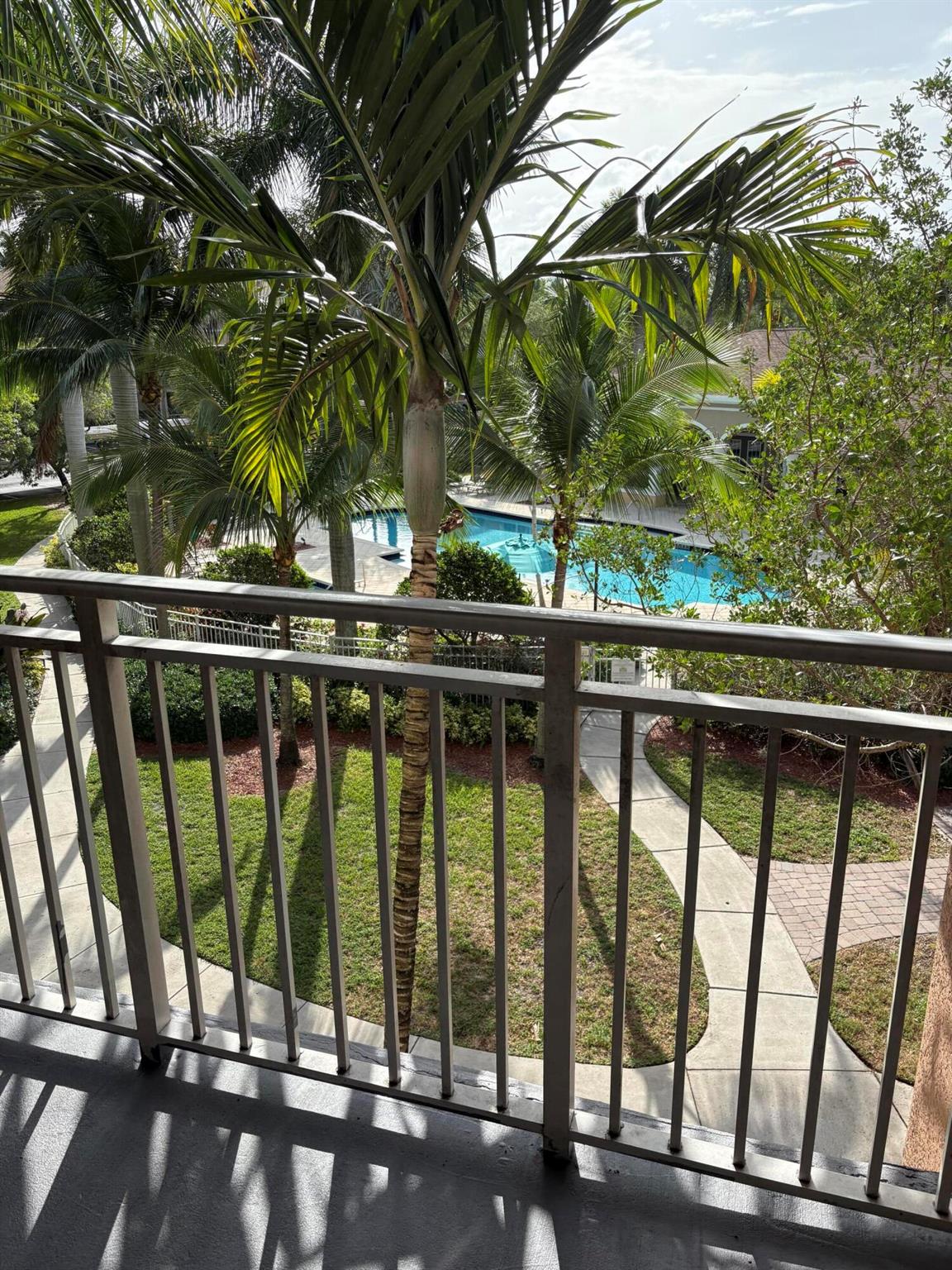 Nicely updated 2 bedroom 2 bath unit with Laminate/tile flooring and granite counters and stainless steel appliances. Real Bonus is a large garage with an additional two spots behind it.