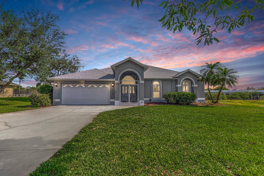 Photo of 2704 SE Eagle Drive, Port Saint Lucie, FL 34984 (MLS # B26037214)