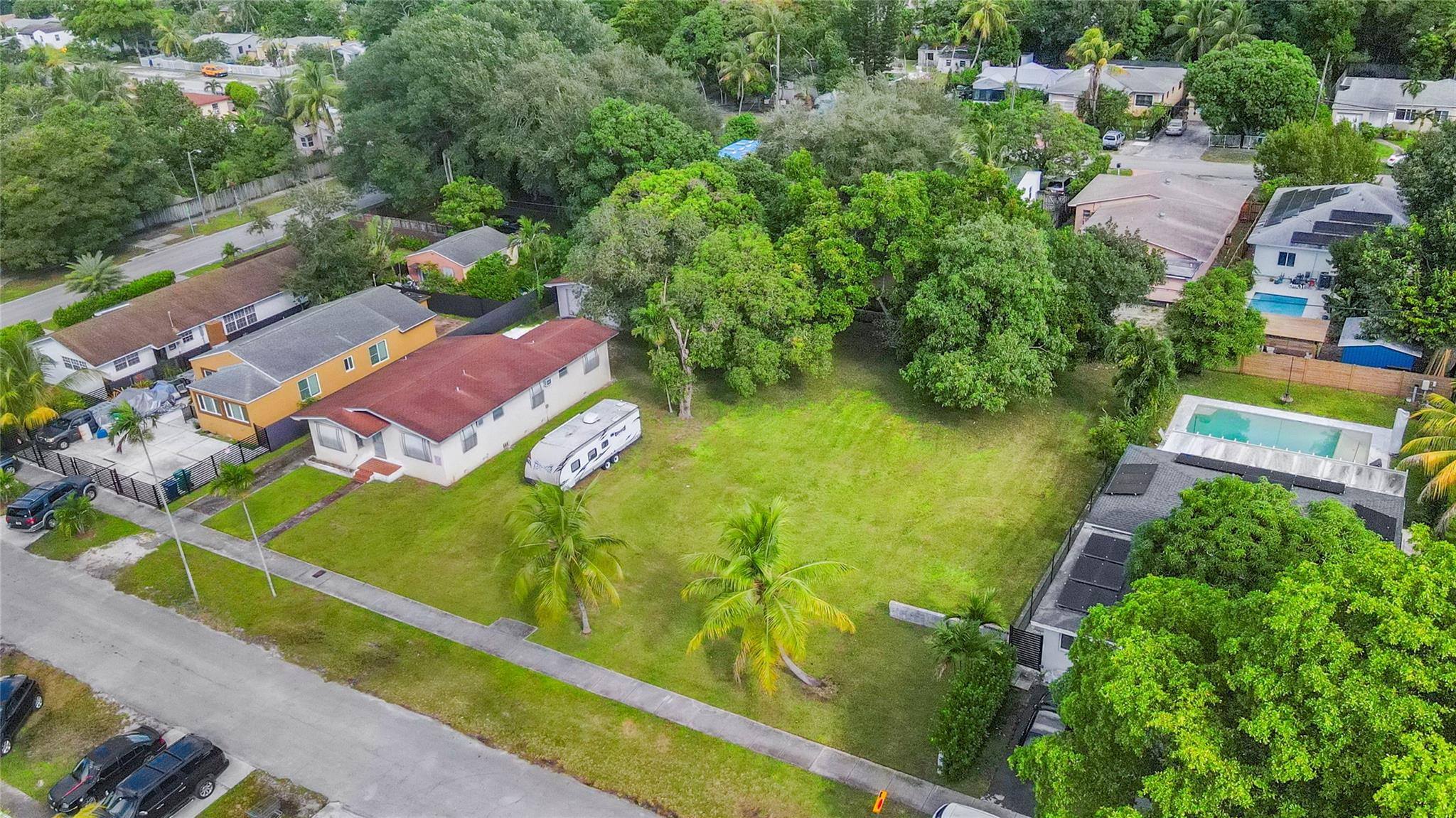 RARE Opportunity in the North Miami area!!!! Set on nearly half an acre, this expansive .47-acre property stands out as one of the largest lots in the neighborhood offering endless possibilities for renovation, expansion, or a custom new build. This mid-century home is ready for a complete transformation, making this ideal for an investor or owner-user looking to create something extraordinary. Mature fruit trees and lush grounds add natural beauty and privacy. A property of this size and potential is seldom available, a true hidden gem that hasn’t been offered for sale in decades. Prime North Miami location just minutes to I-95, quick access to the Palmetto Expressway and just about 10–15 mins to the beach. Close to major shopping, restaurants and the Biscayne Blvd corridor.