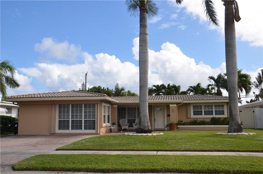 Sprawling remodeled home in famed Imperial Point! Granite eat in kitchen/stainless appls-refrigerator 1 yr. Remodeled baths.Split floor plan.Huge master suite 17x17-large walk in clst.Master bath with dual sinks and large walk in shower-travetine&grohe shower system.Newer AC-2014,Roof 2006,updated windows & doors -accordion shutters.200 amp electrical service.Crown moldings,custom window treatments. Plumbing/sewer lines completely replaced 2011! Private yd-completely fenced 2013-pool,paver patio.Stunning!