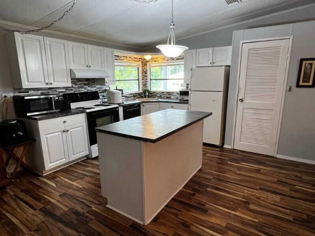 Photo of 2581 SW Pontiac Place, Stuart, FL 34997 (MLS # R11076120)