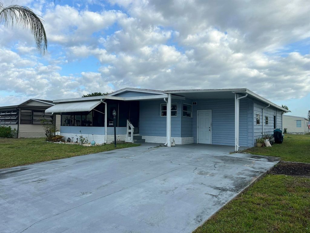 Photo of 2581 SW Pontiac Place, Stuart, FL 34997 (MLS # R11076120)