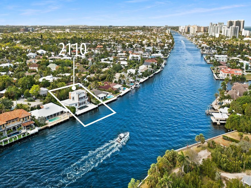 Luxury redefined in this contemporary waterfront estate, situated on 100 feet along the Intracoastal waterway. Every element has been curated to deliver an elevated modern lifestyle with open concept living spaces that harmoniously blend multiple entertaining areas. The luminous floor plan is enhanced by soaring ceilings, walls of glass & multiple doorways bridging indoor & outdoor living spaces. Panoramic wide waterway views from the oversized pool & patio area, multiple balconies & the roof top terrace. The culinary kitchen offers tremendous storage, a large center island, gas cooktop & upgraded appliances. Relish in the oversized primary suite with breathtaking sunrises over the Intracoastal, 2 walk-in closets & a spa inspired bathroom. Feature list available. Sq. Ft. from Appraiser.
