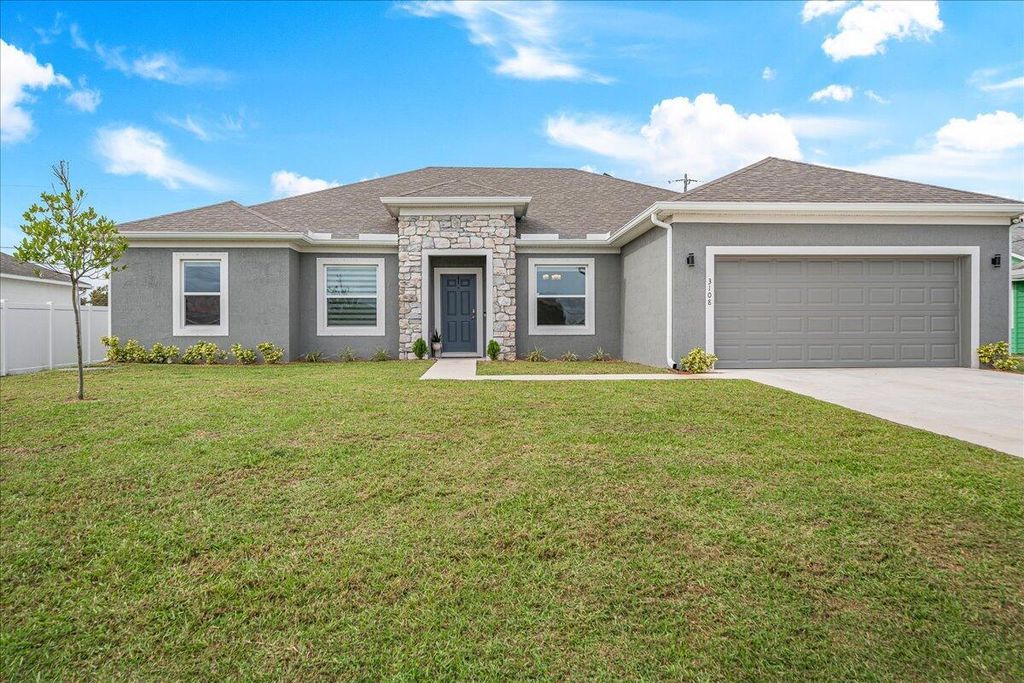 Photo of 3108 SW Nutley Street, Port Saint Lucie, FL 34953 (MLS # R10945854)