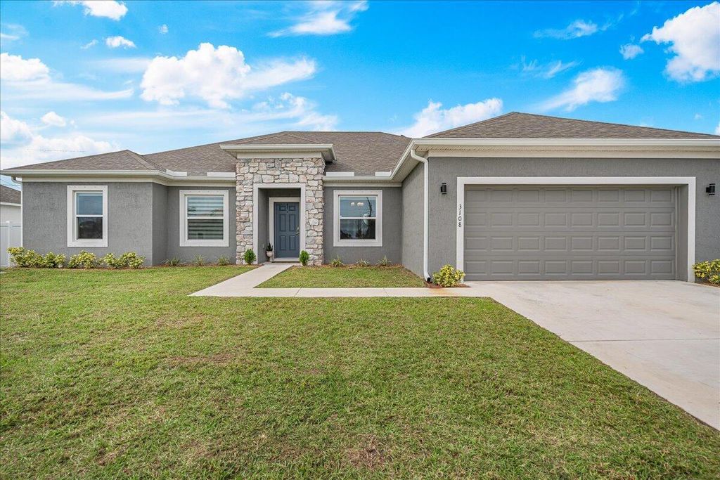 Photo of 3108 SW Nutley Street, Port Saint Lucie, FL 34953 (MLS # R10945854)