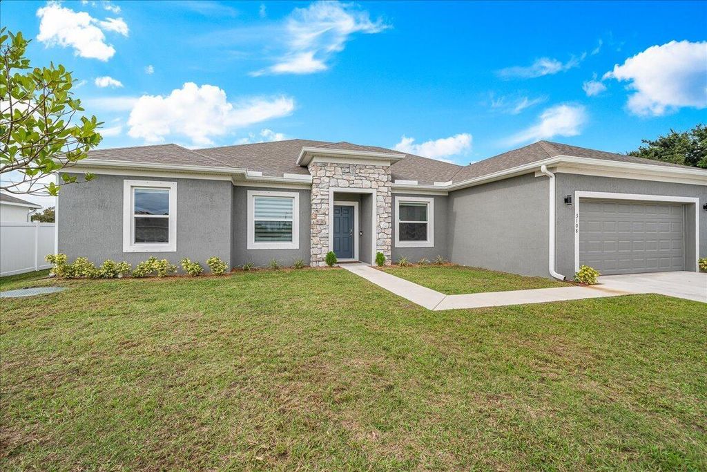 Photo of 3108 SW Nutley Street, Port Saint Lucie, FL 34953 (MLS # R10945854)
