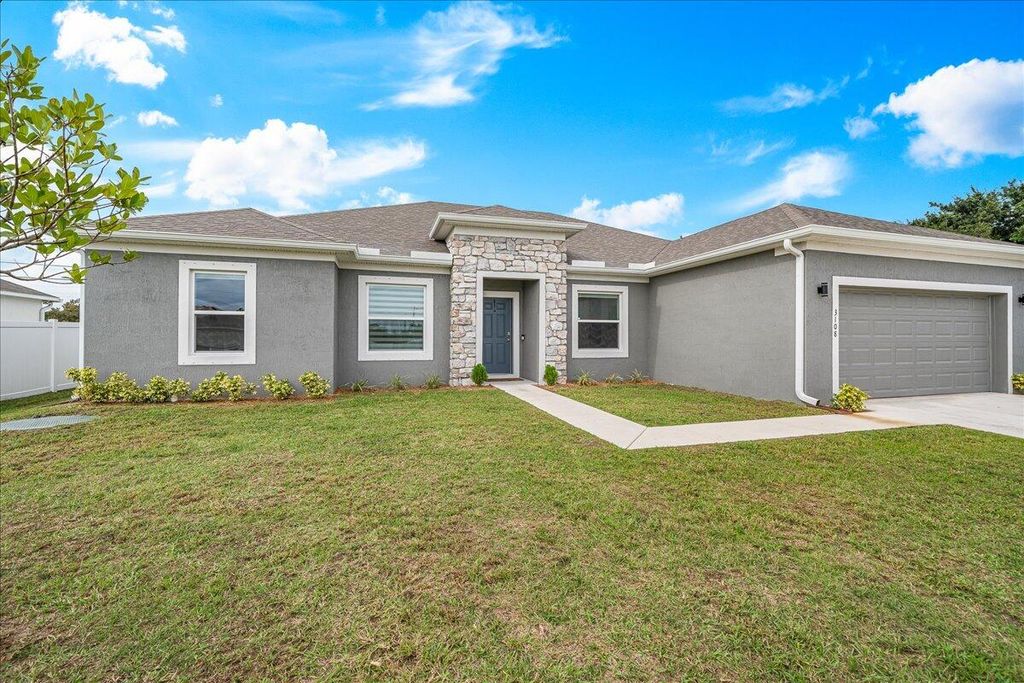 Photo of 3108 SW Nutley Street, Port Saint Lucie, FL 34953 (MLS # R10945854)