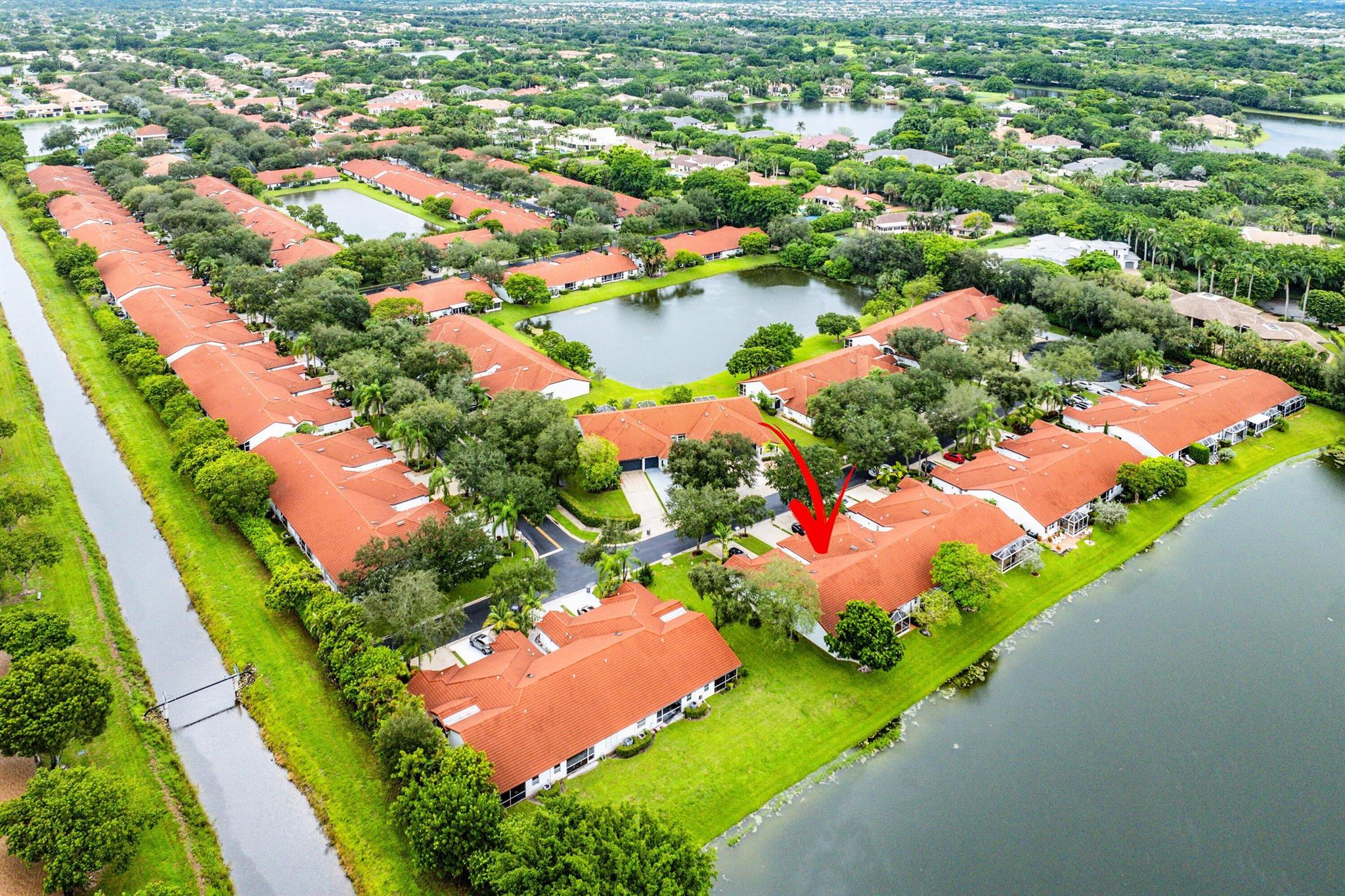 Nestled in the beautiful tree-lined community of Villa San Remo, this spacious 3BD/2BA villa offers vaulted ceilings, an east-facing lake view, and a screened lanai for serene indoor-outdoor living. Thoughtfully updated over the years, it's move-in ready while leaving room for your personal finishing touches.The kitchen features wood cabinetry and a new stainless-steel refrigerator. The primary suite boasts a walk-in closet, while the split bedroom floor plan provides comfort and privacy for family or guests.Additional highlights include a 2020 roof, full accordion shutters, and HOA-maintained roof and lawn care for worry-free ownership.