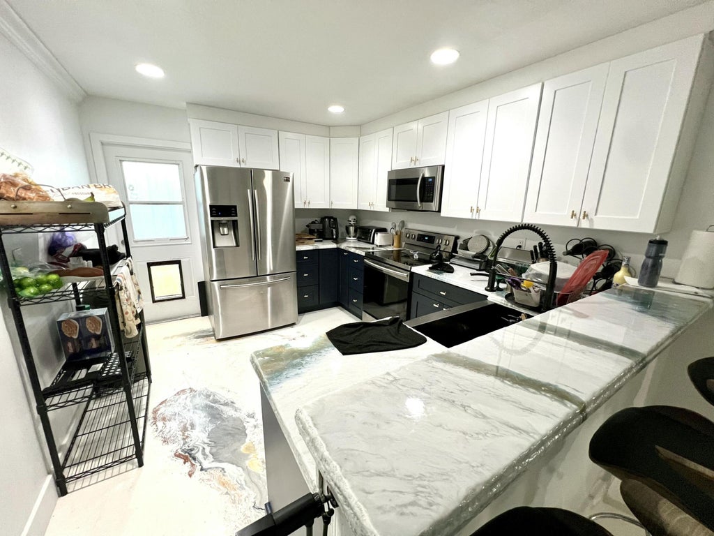 Photo of 703 S A Street S, Lake Worth Beach, FL 33460 (MLS # B26076545)