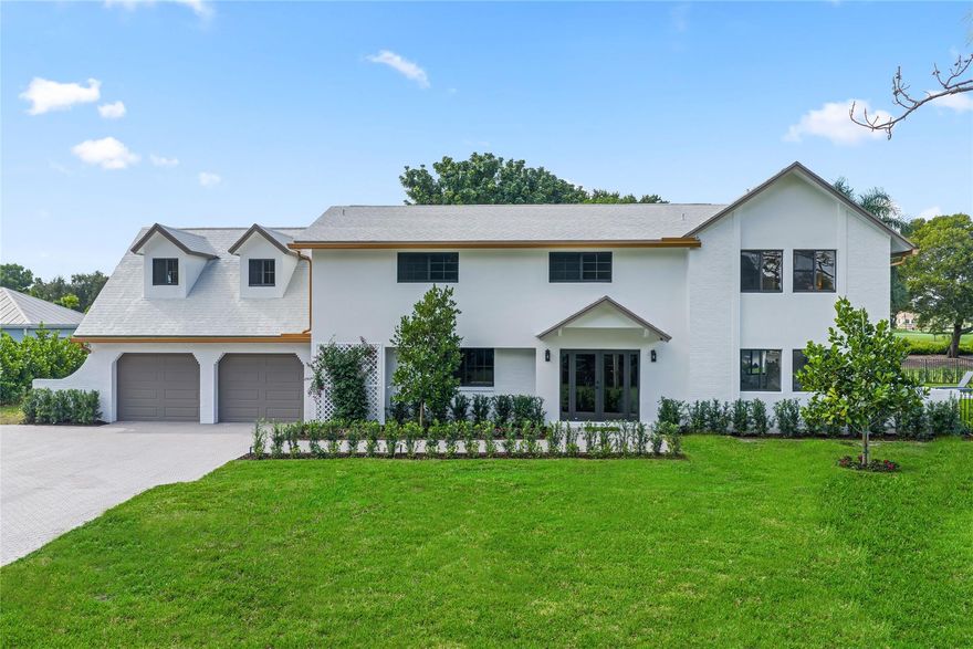 Exquisitely renovated Modern Tudor on a lush ½-acre golf-front lot in the heart of PBG. 5,018 SF | 5 beds (Incl. 2 Master Suites) | Office | Gym | 4.5 baths. Gourmet kitchen with dual islands, Neolith porcelain counters, custom cabinetry, pro appliances & butler’s pantry. Resort-style backyard features new saltwater pool with Carrara marble coping, outdoor kitchen, gas fire pit, artificial turf & mature mango/avocado trees overlooking BallenIsles Country Club. 2022 roof, impact windows, doors and garage doors = max insurance discounts. Recently appraised at $3.8M & priced to sell. No HOA! Walk or golf-cart to PGA Commons, Midtown, groceries & restaurants. 5 min to I-95/Turnpike. 15 min to PBI & DT WPB. Rarely available, fully renovated Hickory Drive masterpiece – move-in ready luxury!