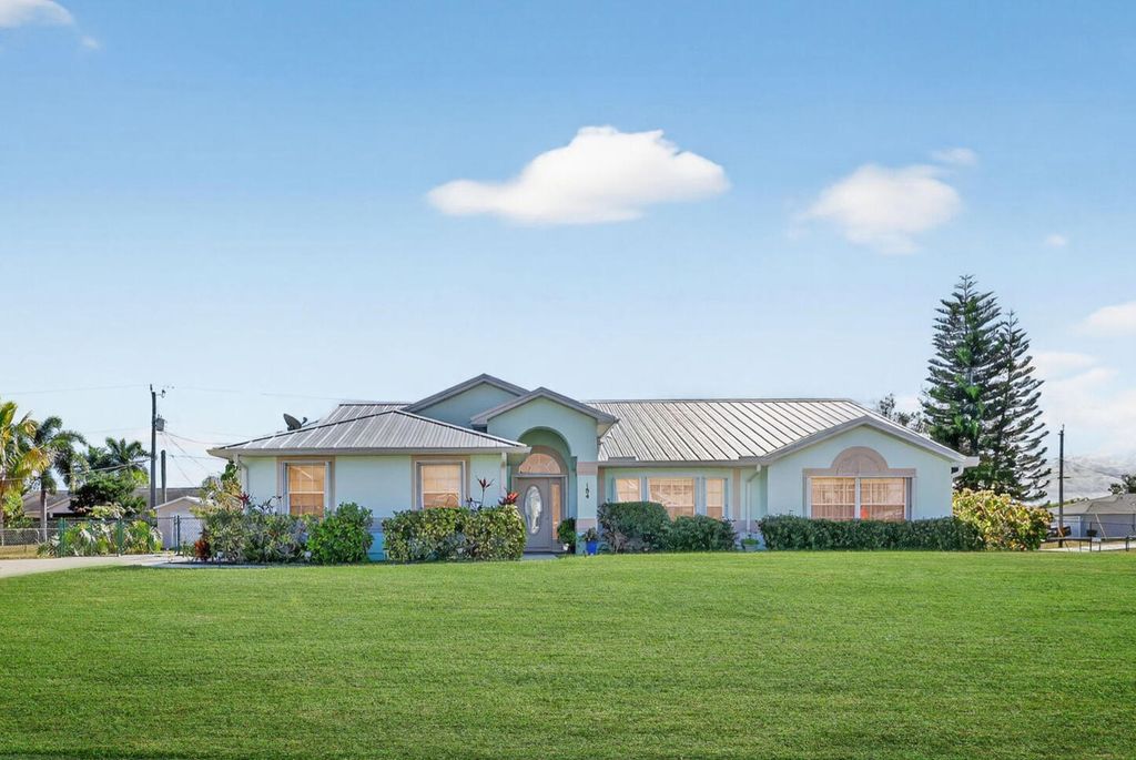 Photo of 184 SW Uneeda Place, Port Saint Lucie, FL 34953 (MLS # R11154132)