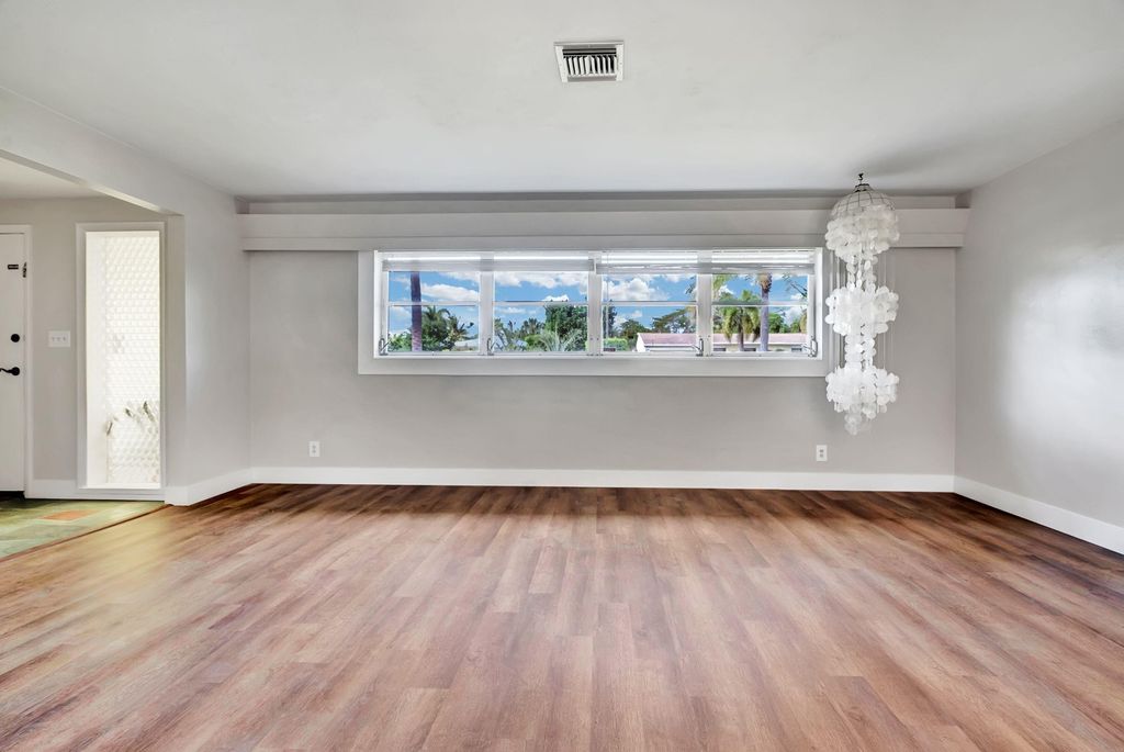 Photo of 148 Date Palm Drive, Lake Park, FL 33403 (MLS # R10972723)