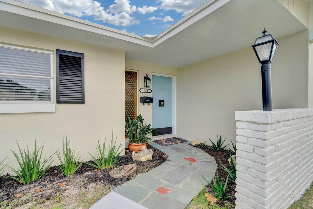 Photo of 148 Date Palm Drive, Lake Park, FL 33403 (MLS # R10972723)