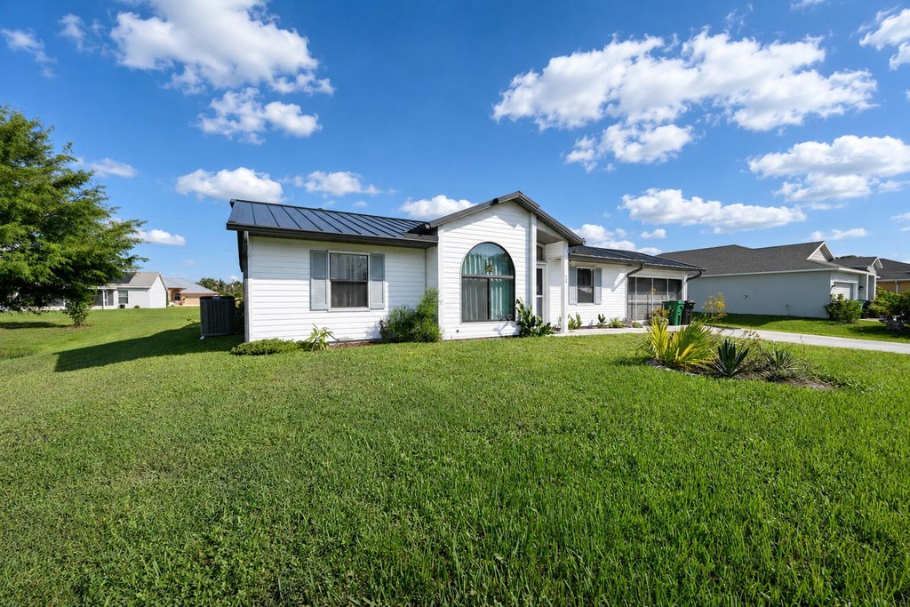 Photo of 409 SW Voltair Terrace, Port Saint Lucie, FL 34984 (MLS # B26065950)