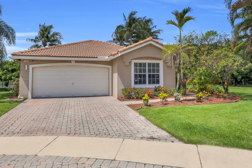 Enjoy the best of South Florida living in this 3-bedroom, 2-bath lakefront home located in the gated community of Briar Bay in West Palm Beach. Featuring an open floor plan, 2-car garage, and oversized side yard, this home offers a functional layout with plenty of space to live and entertain.  The true highlight is the backyard oasis overlooking the lake, complete with a completely remodeled pool featuring sandblasted marble pavers, vanishing edge coping, LED lighting, and a baby gate for added convenience. Whether you're hosting guests or enjoying a quiet evening by the water, this outdoor space was designed to be enjoyed year-round. Home has full hurricane panel protection.  Located in Liberty Isles at Briar Bay, residents enjoy access to resort-style amenities including a clubhouse, pool, fitness center, tennis courts, playground, and more — all conveniently located near shopping, dining, major highways, and everything West Palm Beach has to offer.