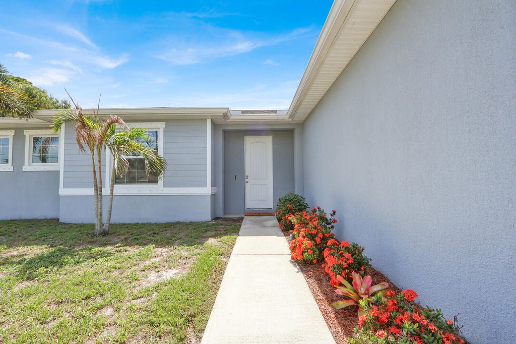 Photo of 3673 SW Bonwold Street, Port Saint Lucie, FL 34953 (MLS # B26058196)