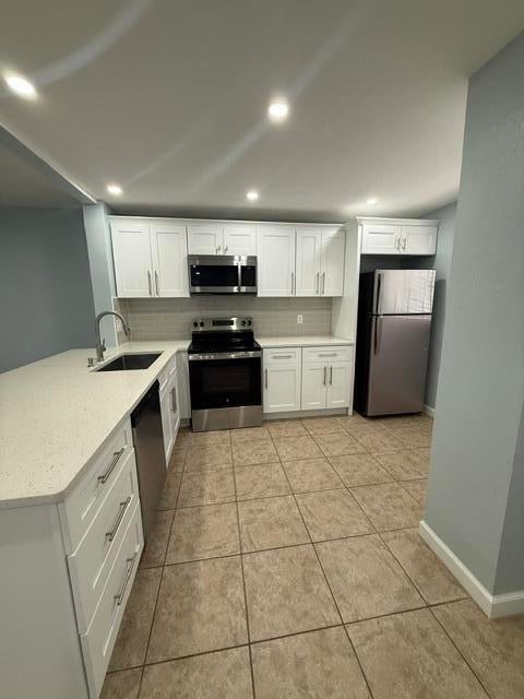 Photo of 701 Palm Beach Trace Drive, Royal Palm Beach, FL 33411 (MLS # B26072753)
