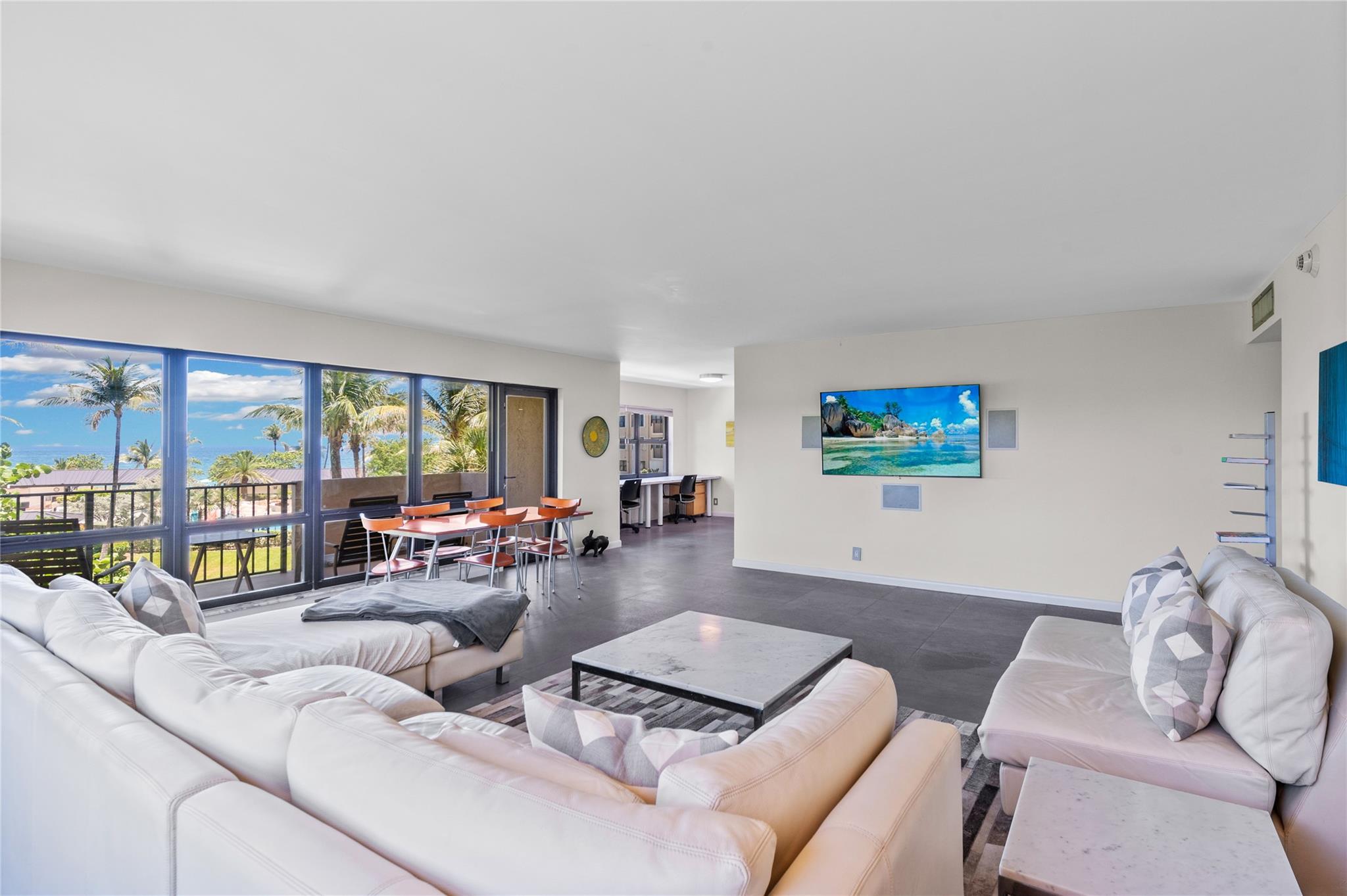 Highly sought-after & rarely available, this 1,900 sq ft beachfront condo offers the ultimate oceanfront lifestyle. Enjoy a spacious balcony with ocean views. Kitchen features stainless steel appliances, blue macaubas countertops, & contemporary cabinetry. Matte grey tile flows throughout. The large primary suite includes a custom walk-in closet and a spa-like bathroom with a soaking tub and separate shower. The guest bedroom opens to a west-facing balcony for sunset views. More features include impact windows and doors, in-unit washer/dryer, 2 garage parking spaces. Amenities: 14 acres of deep beachfront, 3 pools, 3 open-air kitchens with gas grills, beachfront charcoal grills, 8 tennis courts, herb gardens, putting green, 2 dog parks, sauna, gym, EV charging stations, and car wash area.