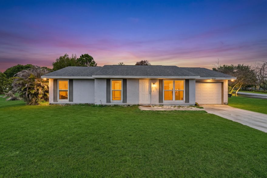 Discover comfort and convenience in this beautifully maintained 3-bedroom, 2-bathroom home situated on an oversized corner lot in a highly desirable location. Featuring updated vinyl plank flooring throughout, this home offers a modern and inviting feel from the moment you walk in. The front of the home is equipped with impact glass windows, adding both style and peace of mind. Step outside to enjoy the fully fenced backyard — perfect for entertaining, pets, or creating your own private outdoor oasis. With plenty of yard space and a prime location close to shopping, dining, schools, and major roadways, this property is a must-see!