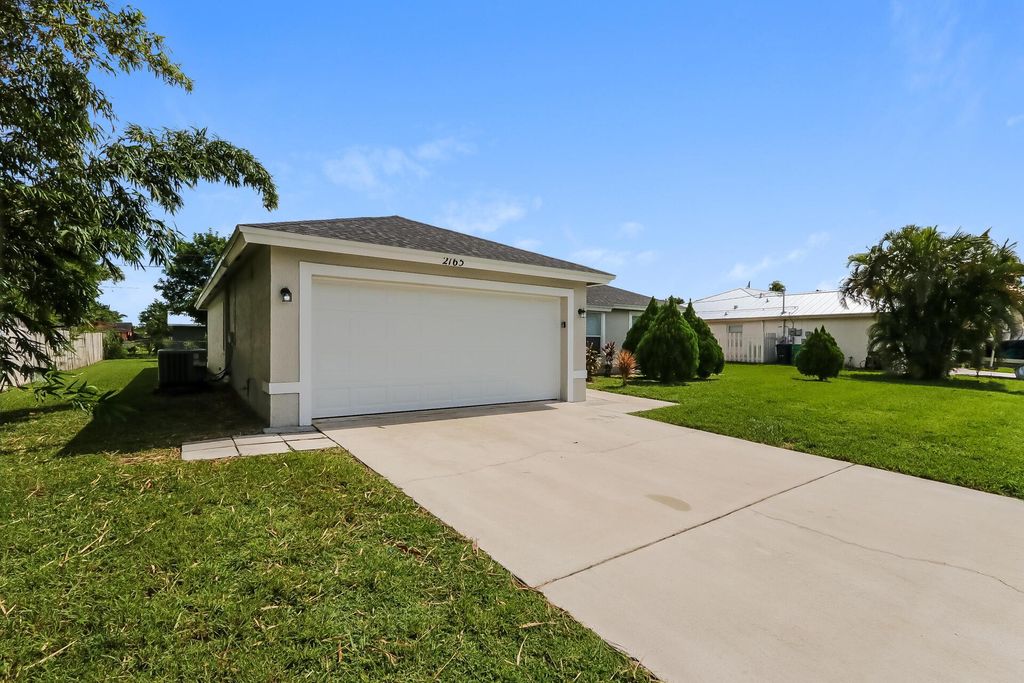 Photo of 2165 SW Monterrey Lane, Port Saint Lucie, FL 34953 (MLS # R11025623)