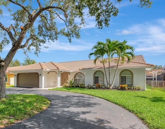 NO HOA! Don't have to worry about assessments! This beautiful, meticulously kept home by the Original Owner, just freshly painted inside and out. Bathrooms were remodeled, 2nd bath has gorgeous porcelain tile, primary nicely done w/step down shower, both have access to pool. Newer appl's in the Kitchen and granite counters. Primary has 2 walk in closets, slidder doors across the living rm to give that natural light and open up to a relaxing and inviting pool area with stamped concrete patio and lanai, great for entertaining or watching weekend sports outside. 2 zoned AC, tile in Living areas and VLP floors in bdrms, Fenced backyard, circular driveway convenient for guests.'A' Rated schools, nearby parks, shopping, restaurants, Sawgrass Exy & trnpke. OPEN HOUSE 7/12 12-3:00