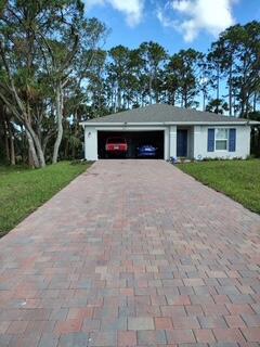 Come see this immaculate newly built in 2022.. Beautiful 3-bed, 2-bath CBS home in Port LaBelle offering a split-bedroom layout, with an open living/dining area. Boasting a large kitchen enrobed in quartz with pantry and appliances included. There is Tile in the main areas, and carpet in the bedrooms, with walk-in closets, manual shutters, and washer/dryer.. Primary suite is spacious with modern finishes and has an insuite bathroom. Home is Situated on a quarter acre lot with a landscaped view, 2-car attached garage, a lovely paver driveway, and a shingle roof. Central HVAC, water, and septic. No HOA. Great for owner-occupants or investors! Don't miss this rare opportunity to own for such an amazing price!