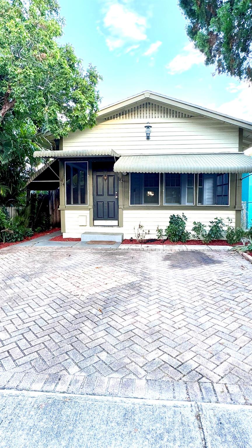 Looking for a house with tons of character? This is it! Nicely updated single family Key West style house in Downtown Lake Worth. 2 bedrooms and 2 full bathrooms, remodeled kitchen with stainless steel appliances, updated bathrooms, fireplace, exposed wood beams. Walk to restaurants and shops, close to Lake Worth Beach and I-95. Beautiful screened in porch, brick paver driveway for 2 cars plus additional street parking. Spacious backyard.