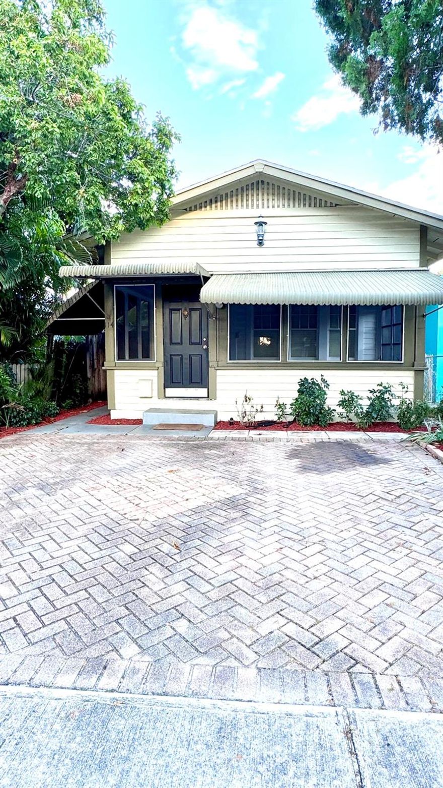 Looking for a house with tons of character? This is it! Nicely updated single family Key West style house in Downtown Lake Worth. 2 bedrooms and 2 full bathrooms, remodeled kitchen with stainless steel appliances, updated bathrooms, fireplace, exposed wood beams. Walk to restaurants and shops, close to Lake Worth Beach and I-95. Beautiful screened in porch, brick paver driveway for 2 cars plus additional street parking. Spacious backyard.